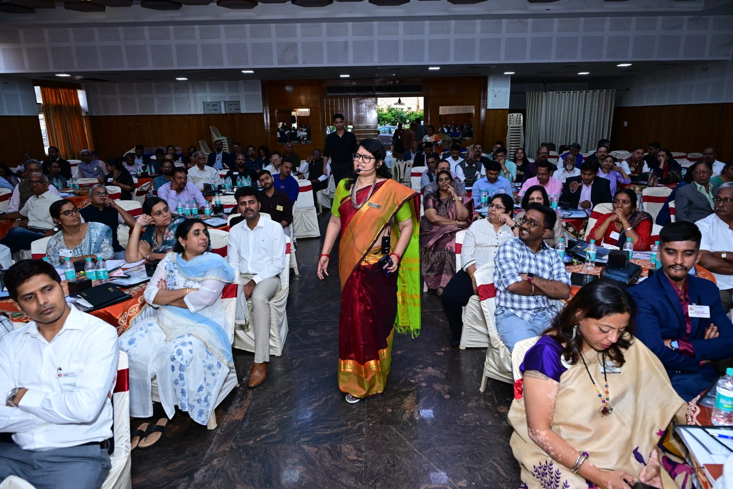Janani Ramakrishnan walking through the audience during an interactive session